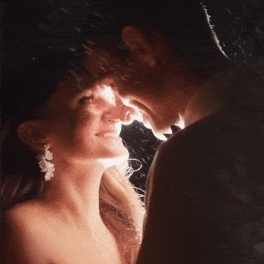 Couple framed closely in warm evening light